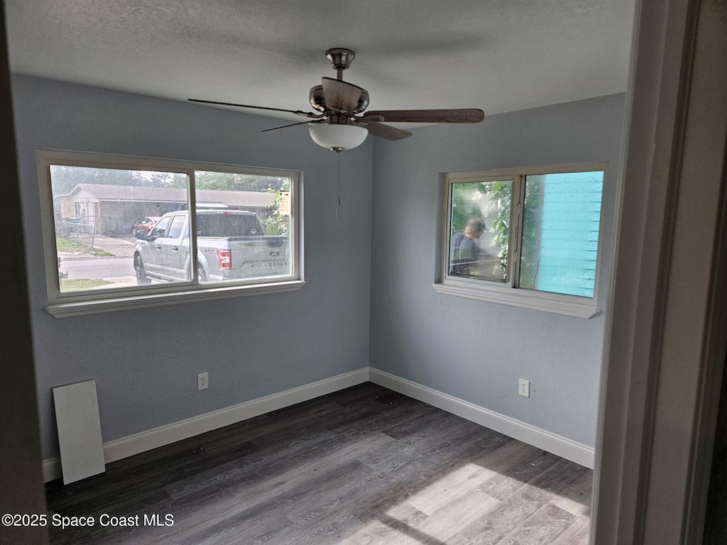 2062 E Cedarwood Dr, Melbourne, FL 32935 - spare room featuring plenty of natural light, wood finished floors, and a ceiling fan