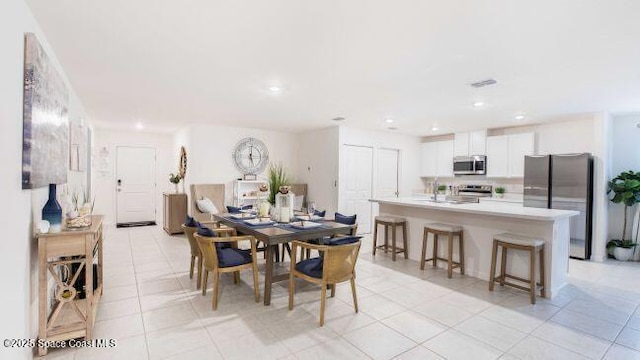 783 Kingfisher St, Palm Bay, FL 32908 - dining space with light tile patterned floors and recessed lighting
