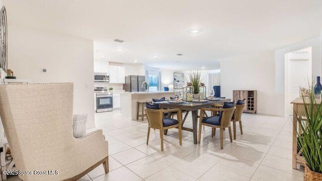 783 Kingfisher St, Palm Bay, FL 32908 - dining room featuring light tile patterned floors and recessed lighting