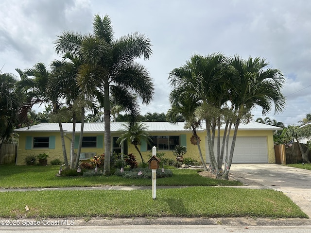 1195 Yacht Club Blvd, Satellite Beach, FL 32937 - single story home featuring an attached garage, concrete driveway, and stone siding