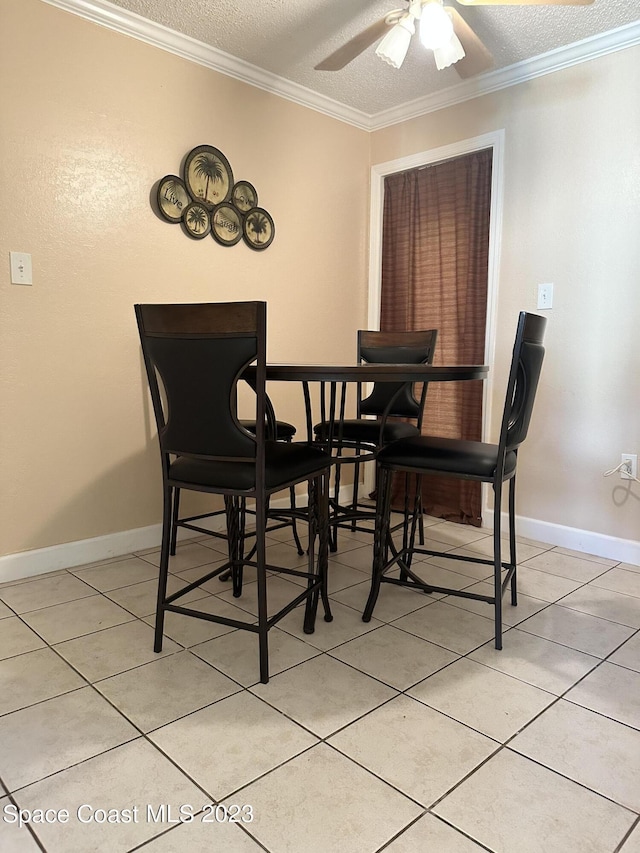 350 Taylor Ave Unit 11B2, Cape Canaveral, FL 32920 - dining room featuring crown molding, a textured ceiling, a ceiling fan, and light tile patterned flooring