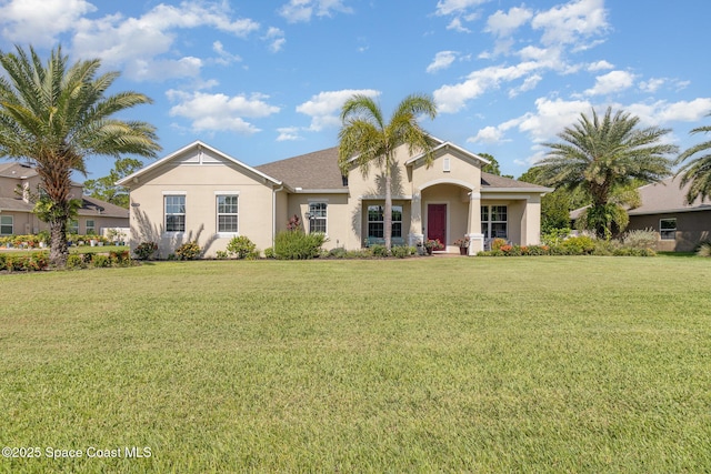 4014 Preservation Cir, Melbourne, FL 32934 - view of front of house with stucco siding and a front lawn