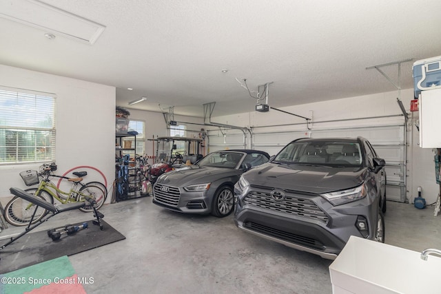 4014 Preservation Cir, Melbourne, FL 32934 - garage with a garage door opener and a sink