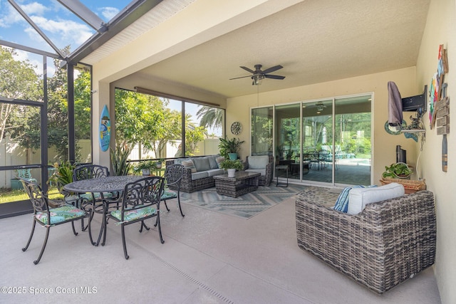 4014 Preservation Cir, Melbourne, FL 32934 - view of patio with an outdoor living space, a ceiling fan, glass enclosure, and outdoor dining space