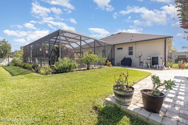 4014 Preservation Cir, Melbourne, FL 32934 - back of property with stucco siding, a lawn, a patio area, and a lanai