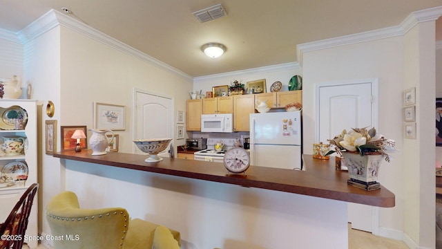 6461 Borasco Dr Unit 1805, Melbourne, FL 32940 - kitchen with white appliances, dark countertops, crown molding, a kitchen bar, and a peninsula