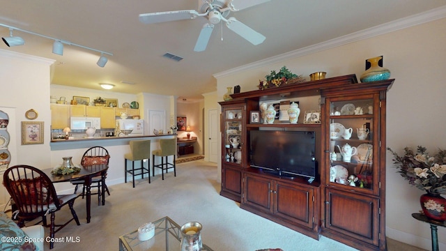 6461 Borasco Dr Unit 1805, Melbourne, FL 32940 - living room featuring a ceiling fan, ornamental molding, light colored carpet, and track lighting