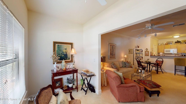 6461 Borasco Dr Unit 1805, Melbourne, FL 32940 - living area with a ceiling fan and light carpet