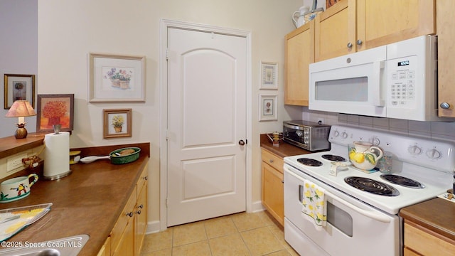 6461 Borasco Dr Unit 1805, Melbourne, FL 32940 - kitchen with white appliances, light brown cabinets, and light tile patterned floors