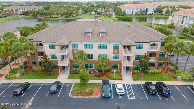 6461 Borasco Dr Unit 1805, Melbourne, FL 32940 - view of property with uncovered parking and a water view