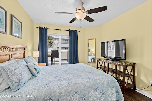 8600 Ridgewood Ave Unit 1311, Cape Canaveral, FL 32920 - bedroom with wood finished floors, a textured ceiling, and a ceiling fan