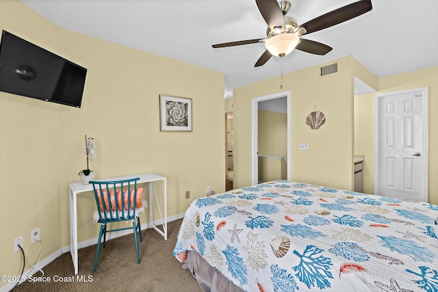 8600 Ridgewood Ave Unit 1311, Cape Canaveral, FL 32920 - carpeted bedroom featuring baseboards and a ceiling fan