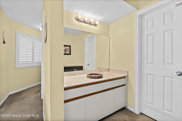 8600 Ridgewood Ave Unit 1311, Cape Canaveral, FL 32920 - bathroom with vanity and a textured ceiling