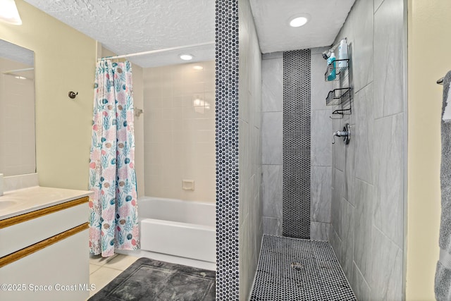 8600 Ridgewood Ave Unit 1311, Cape Canaveral, FL 32920 - bathroom featuring tile patterned floors, shower / bath combo with shower curtain, vanity, and a textured ceiling