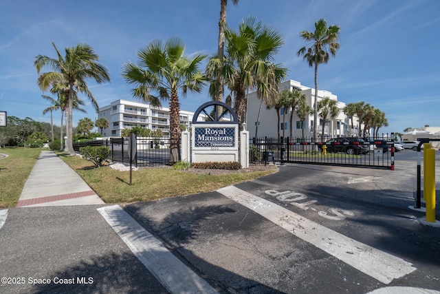 8600 Ridgewood Ave Unit 1311, Cape Canaveral, FL 32920 - community sign featuring uncovered parking and a gate