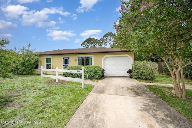 957 Stage St SE, Palm Bay, FL 32909 - single story home with driveway, a garage, and stucco siding