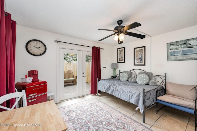 957 Stage St SE, Palm Bay, FL 32909 - bedroom featuring light tile patterned floors, access to exterior, french doors, and a ceiling fan