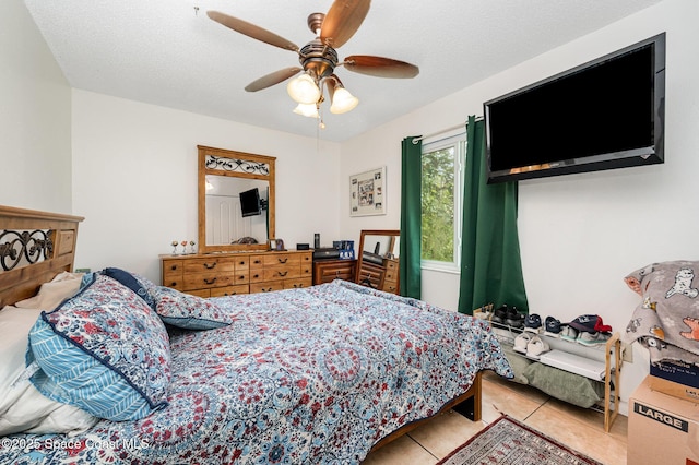 957 Stage St SE, Palm Bay, FL 32909 - bedroom with light tile patterned floors and a ceiling fan