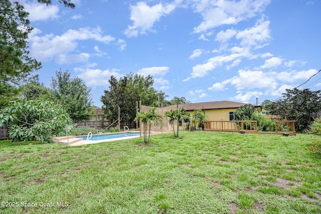 957 Stage St SE, Palm Bay, FL 32909 - fenced backyard featuring a wooden deck