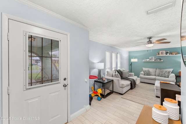 416 Catalina Ave NW, Palm Bay, FL 32907 - living area with a textured ceiling, ornamental molding, and a ceiling fan