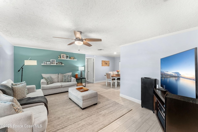 416 Catalina Ave NW, Palm Bay, FL 32907 - living room with a ceiling fan, a textured ceiling, light wood-style flooring, and ornamental molding