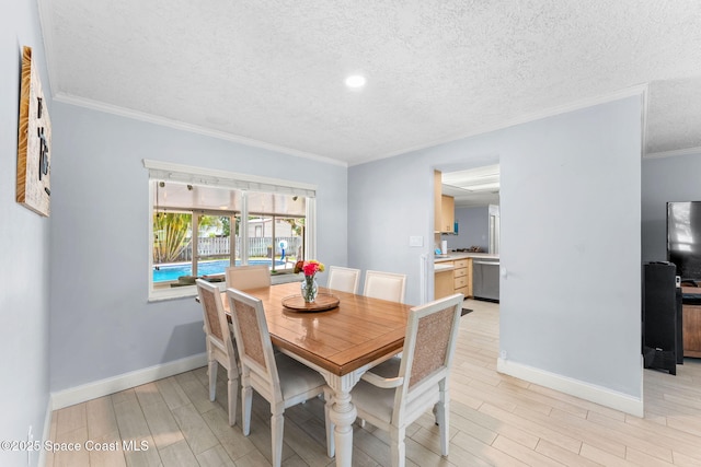 416 Catalina Ave NW, Palm Bay, FL 32907 - dining space featuring wood finish floors, ornamental molding, a textured ceiling, and recessed lighting