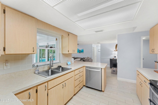 416 Catalina Ave NW, Palm Bay, FL 32907 - kitchen with stainless steel dishwasher, light brown cabinetry, light countertops, and a peninsula