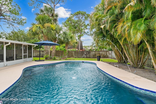 416 Catalina Ave NW, Palm Bay, FL 32907 - view of swimming pool featuring a sunroom, a fenced backyard, and a patio area