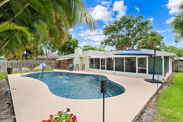 416 Catalina Ave NW, Palm Bay, FL 32907 - view of pool featuring a sunroom, a fenced backyard, and a patio area