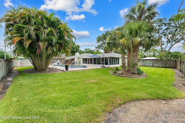 416 Catalina Ave NW, Palm Bay, FL 32907 - fenced backyard with a sunroom