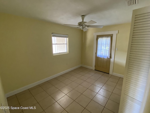 208 Johnson Ave, Cape Canaveral, FL 32920 - entryway with plenty of natural light, light tile patterned flooring, and a ceiling fan