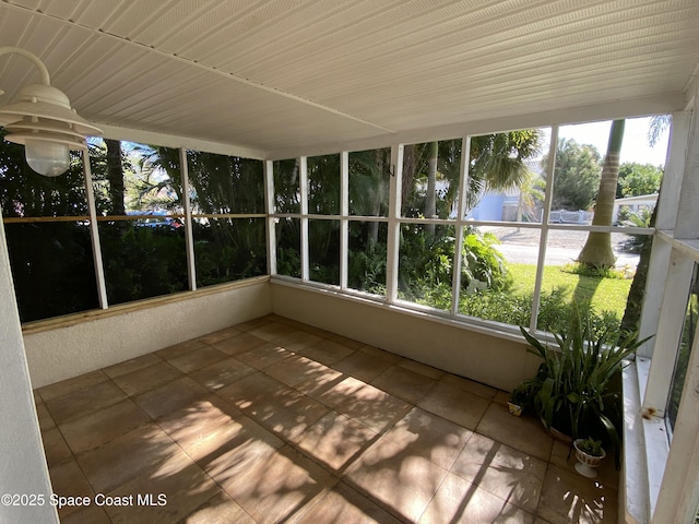 208 Johnson Ave, Cape Canaveral, FL 32920 - unfurnished sunroom featuring tile patterned flooring