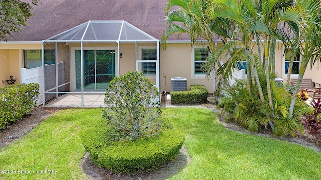 5727 Tamarac Dr, Melbourne, FL 32940 - rear view of property with stucco siding, a lawn, and a patio