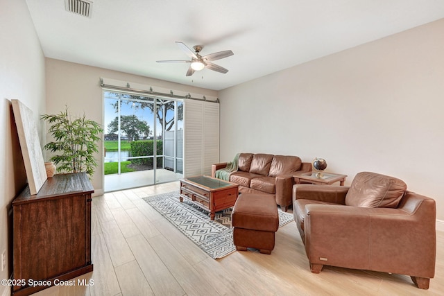 5727 Tamarac Dr, Melbourne, FL 32940 - living area with ceiling fan and light wood-type flooring
