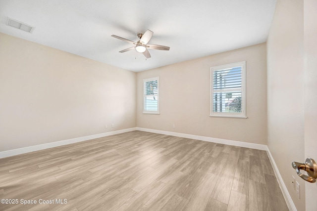 5727 Tamarac Dr, Melbourne, FL 32940 - empty room featuring a ceiling fan and light wood-style floors