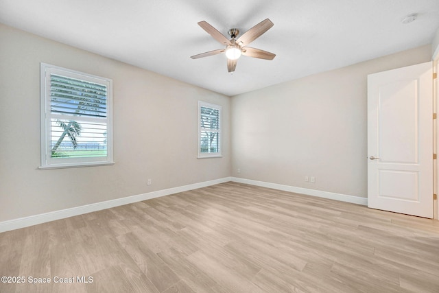 5727 Tamarac Dr, Melbourne, FL 32940 - spare room with plenty of natural light, light wood-style floors, a ceiling fan, and a smoke detector