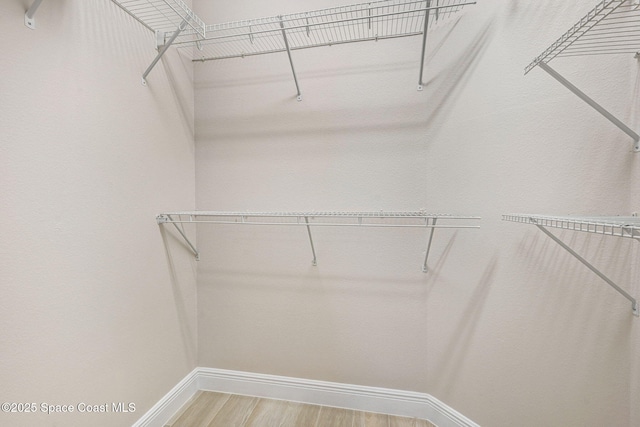 5727 Tamarac Dr, Melbourne, FL 32940 - spacious closet with light wood finished floors