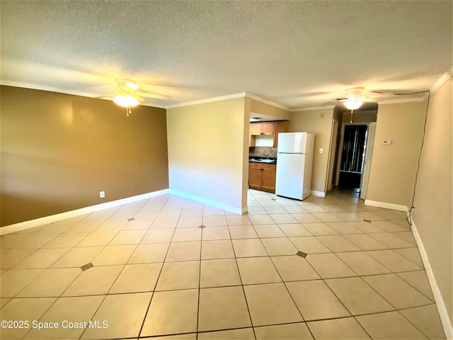261 Cape Shores Cir Unit 18I, Cape Canaveral, FL 32920 - spare room with a ceiling fan, crown molding, and a textured ceiling