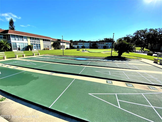 261 Cape Shores Cir Unit 18I, Cape Canaveral, FL 32920 - view of property's community featuring a yard and shuffleboard