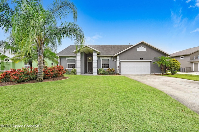 1067 Red Bud Cir, Rockledge, FL 32955 - ranch-style home featuring a garage, stucco siding, driveway, and a front yard