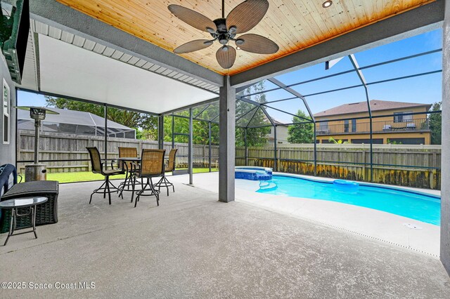 1067 Red Bud Cir, Rockledge, FL 32955 - view of pool featuring a fenced backyard, a patio area, a pool with connected hot tub, a lanai, and a ceiling fan