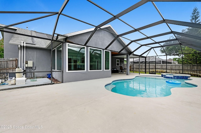 1067 Red Bud Cir, Rockledge, FL 32955 - view of swimming pool with a patio area, a fenced backyard, a pool with connected hot tub, and a lanai
