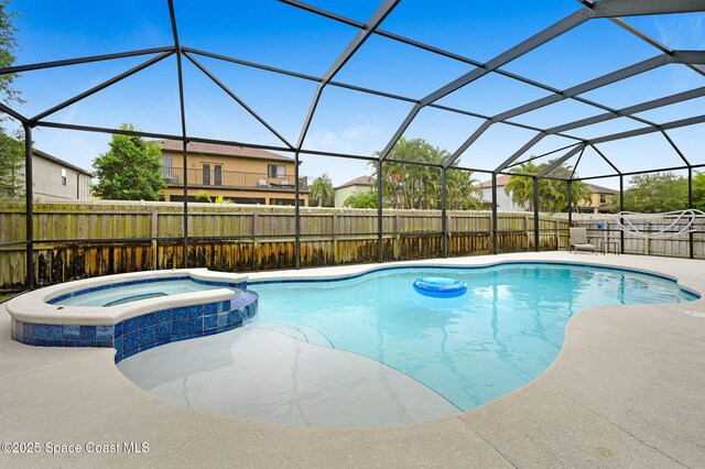 1067 Red Bud Cir, Rockledge, FL 32955 - view of pool featuring a pool with connected hot tub, a patio area, and a lanai