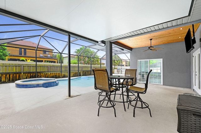 1067 Red Bud Cir, Rockledge, FL 32955 - view of swimming pool with ceiling fan, a pool with connected hot tub, a patio area, and a lanai