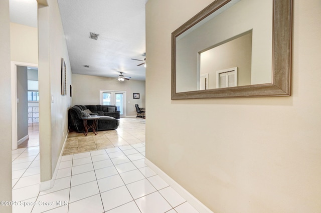 1067 Red Bud Cir, Rockledge, FL 32955 - hallway featuring tile patterned floors and baseboards