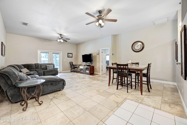 1067 Red Bud Cir, Rockledge, FL 32955 - living room featuring a ceiling fan and light tile patterned floors