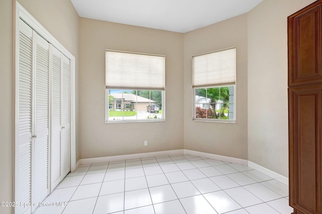 1067 Red Bud Cir, Rockledge, FL 32955 - unfurnished bedroom with a closet and light tile patterned floors