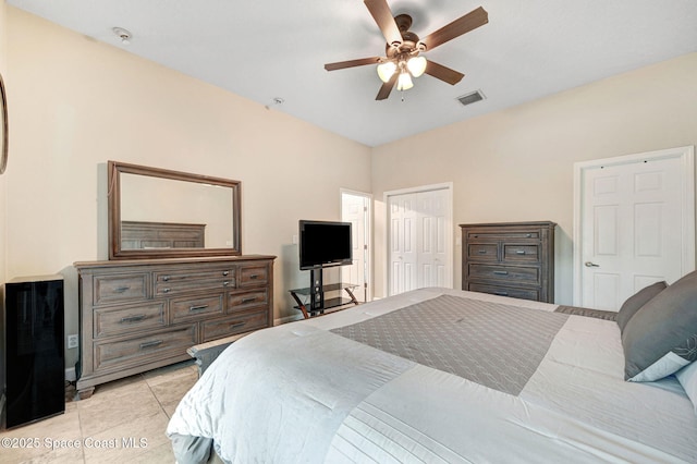 1067 Red Bud Cir, Rockledge, FL 32955 - bedroom featuring light tile patterned floors, a ceiling fan, and a closet