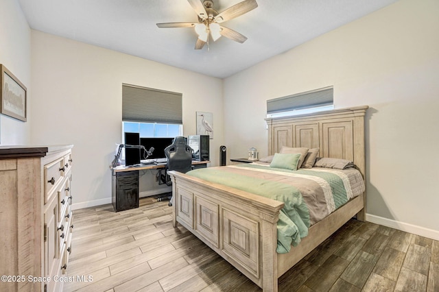 1067 Red Bud Cir, Rockledge, FL 32955 - bedroom featuring light wood-style flooring, an office area, and ceiling fan