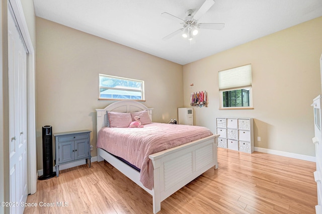 1067 Red Bud Cir, Rockledge, FL 32955 - bedroom with light wood-style floors and ceiling fan